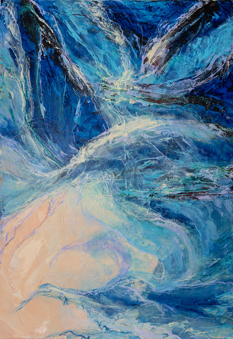 Ebb and flow - A curling mass of shallows is stranded on a tiny beach in amongst the rocks.